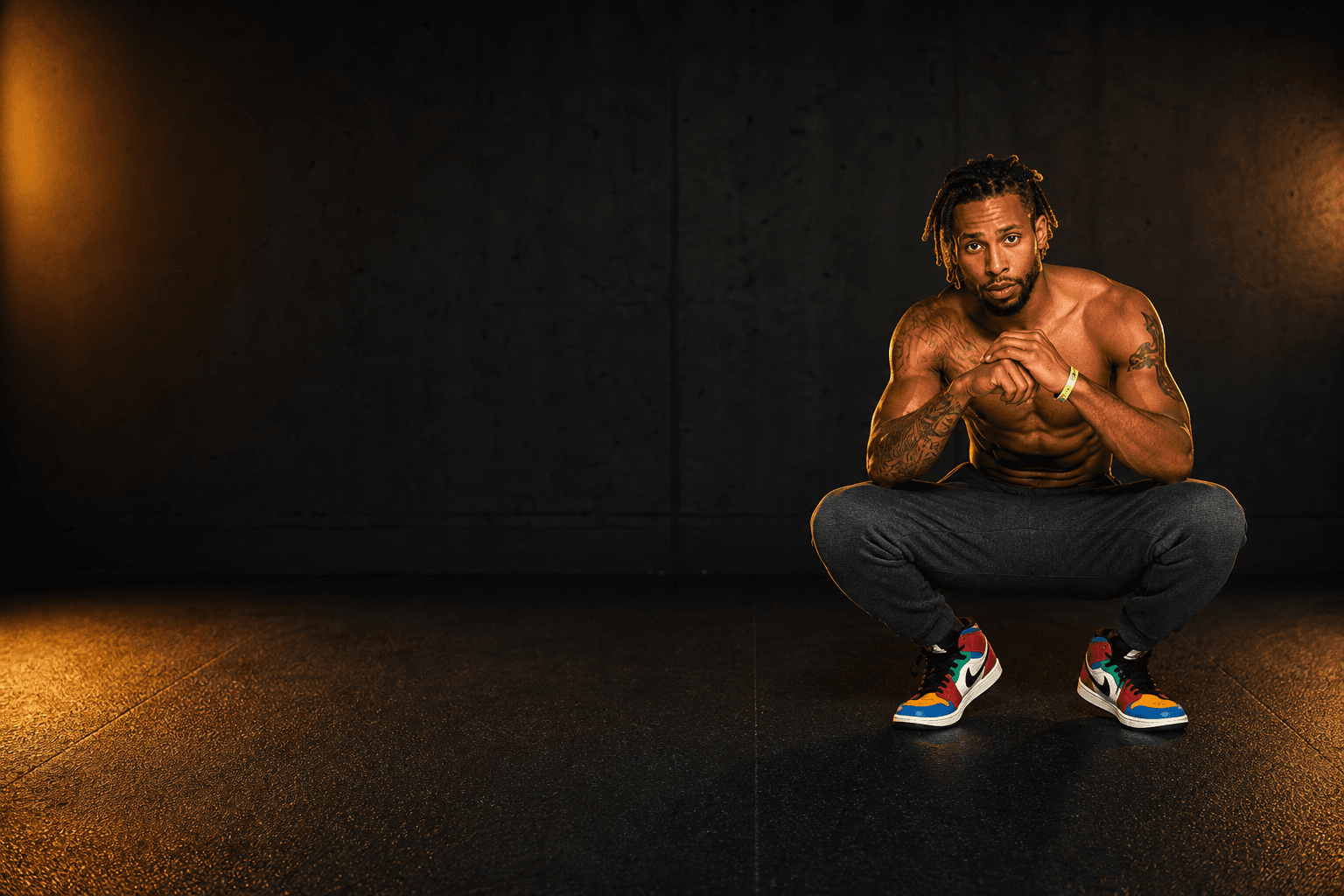 Flex in a dramatic athletic studio portrait